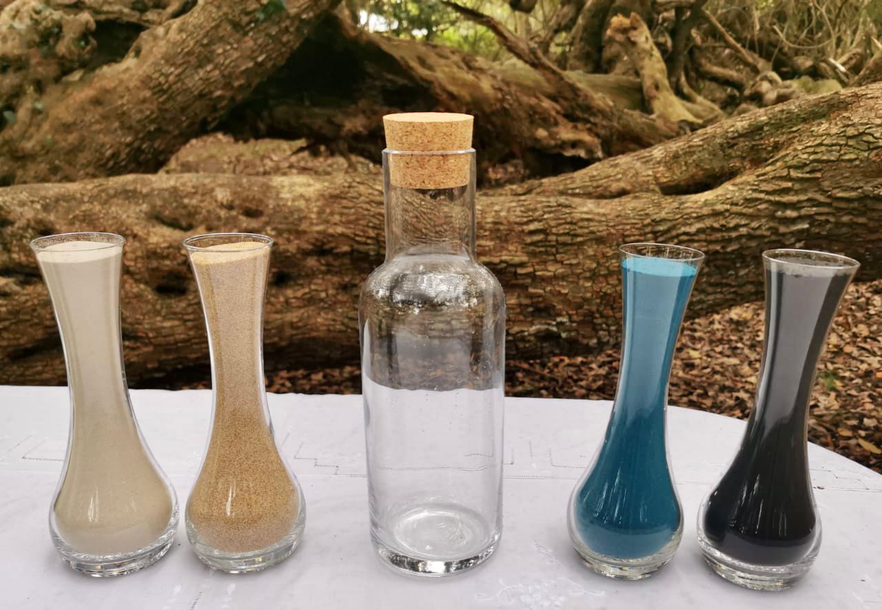 Unity sand ceremony glassware with white, natural, blue and charcoal sand