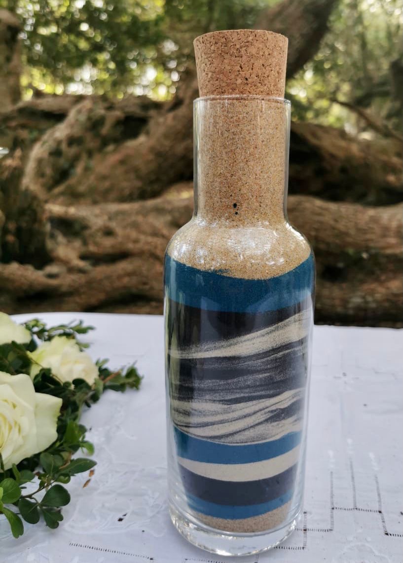 Layered coloured Unity Sand in a keepsake vase